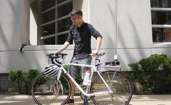 Anthony Rowe, an associate professor at Carnegie Mellon University in Pittsburgh, wants bikes to feed information to nearby cars to avoid collisions. His bike is fitted with an array of precise instruments and a battery hidden in the water bottle. Anthony Rowe, an associate professor at Carnegie Mellon University in Pittsburgh, wants bikes to feed information to nearby cars to avoid collisions. His bike is fitted with an array of precise instruments and a battery hidden in the water bottle.