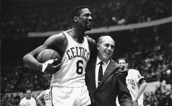 Bill Russell (left) star of the Boston Celtics is congratulated by coach Arnold "Red" Auerbach after scoring his 10,000th point in the NBA on Dec. 12, 1964. Bill Russell (left) star of the Boston Celtics is congratulated by coach Arnold "Red" Auerbach after scoring his 10,000th point in the NBA on Dec. 12, 1964.