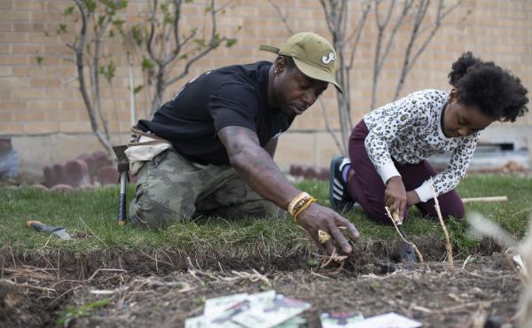 Ietef "DJ Cavem Moetavation" Vita plants seeds with daughter Libya LeaDonvita in the garden at their home outside Denver. Vita is among a growing list of Black gardening enthusiasts-turned-entrepreneurs across the country who've launched seed businesses d Ietef "DJ Cavem Moetavation" Vita plants seeds with daughter Libya LeaDonvita in the garden at their home outside Denver. Vita is among a growing list of Black gardening enthusiasts-turned-entrepreneurs across the country who've launched seed businesses d