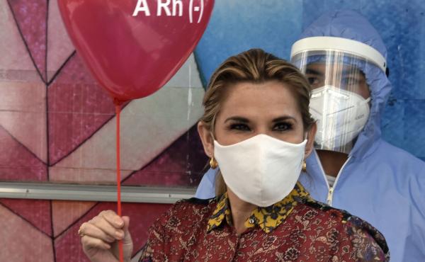 Bolivian President Jeanine Áñez is pictured before donating blood at the presidential palace in La Paz last month amid the COVID-19 pandemic. Bolivian President Jeanine Áñez is pictured before donating blood at the presidential palace in La Paz last month amid the COVID-19 pandemic.