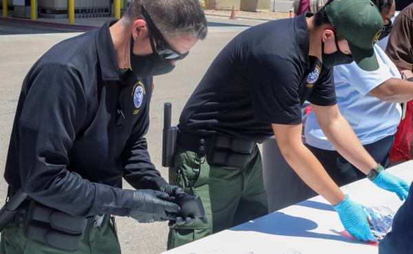 Officials help process and log personal items from migrants entering the Central Processing Center in El Paso, Texas, in this May 4 photo provided by the U.S. Border Patrol. Officials help process and log personal items from migrants entering the Central Processing Center in El Paso, Texas, in this May 4 photo provided by the U.S. Border Patrol.