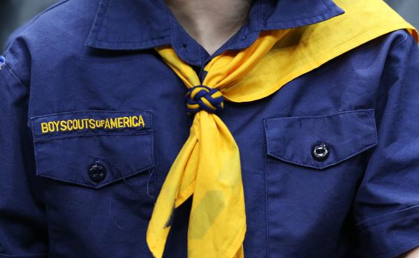A boy scout in uniform. A boy scout in uniform.