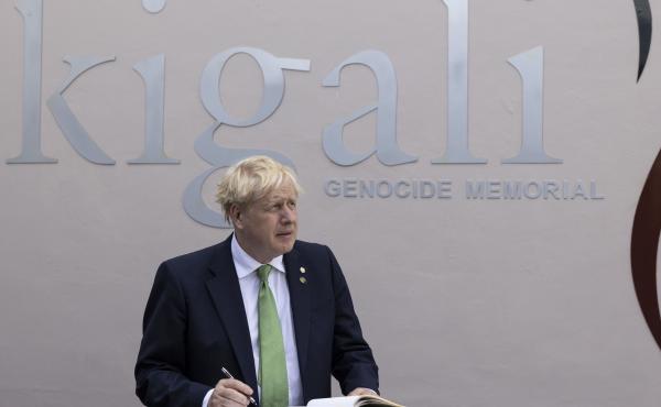British Prime Minister Boris Johnson signs the visitors book while visiting the Kigali Genocide Memorial in Kigali, Rwanda, Thursday June 23, 2022. British Prime Minister Boris Johnson signs the visitors book while visiting the Kigali Genocide Memorial in Kigali, Rwanda, Thursday June 23, 2022.