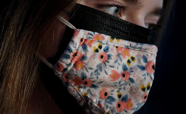 As new, more transmissible variants of the coronavirus spread, the CDC says wearing a cloth mask over a surgical mask offers increased protection against the virus. As new, more transmissible variants of the coronavirus spread, the CDC says wearing a cloth mask over a surgical mask offers increased protection against the virus.