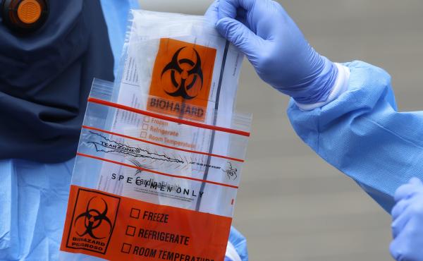 A COVID-19 test is collected in Salt Lake City, Utah. A federal study published Monday found that Hispanic and non-white workers make up a disproportionate share of COVID-19 cases associated with workplace outbreaks in Utah. A COVID-19 test is collected in Salt Lake City, Utah. A federal study published Monday found that Hispanic and non-white workers make up a disproportionate share of COVID-19 cases associated with workplace outbreaks in Utah.