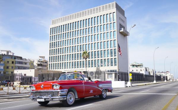 A car drives past the U.S. Embassy in Havana in 2019. Americans working at the embassy began reporting unexplained illnesses in 2016. A car drives past the U.S. Embassy in Havana in 2019. Americans working at the embassy began reporting unexplained illnesses in 2016.