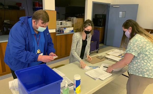 Holmes County, Ohio, General Health District staff members (from left) Michael Derr, Jennifer Talkington and Abbie Benton prepare materials for a COVID-19 vaccine clinic this month inside St. Peter's Catholic Church in Millersburg. Holmes County, Ohio, General Health District staff members (from left) Michael Derr, Jennifer Talkington and Abbie Benton prepare materials for a COVID-19 vaccine clinic this month inside St. Peter's Catholic Church in Millersburg.