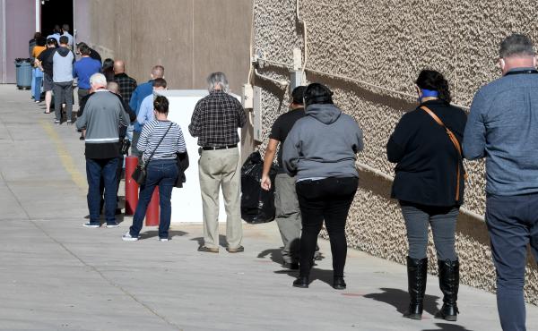 People line up on Thursday for the first day of Clark County's pilot COVID-19 vaccination program at Cashman Center in Las Vegas. People line up on Thursday for the first day of Clark County's pilot COVID-19 vaccination program at Cashman Center in Las Vegas.