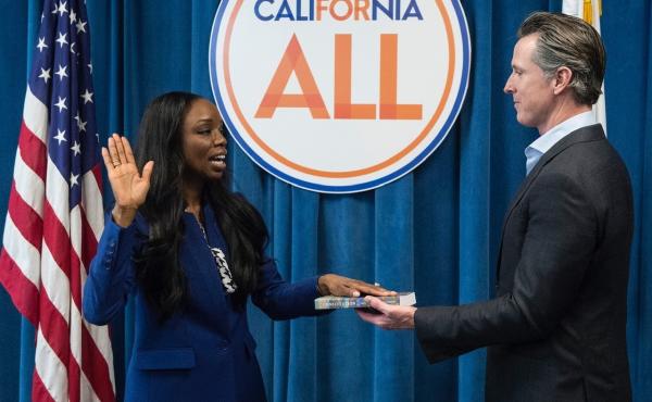 California's first surgeon general, Dr. Nadine Burke Harris, is sworn in by Gov. Gavin Newsom in February 2019. A leading voice on health care equity, she's helping shape the state's vaccination makeover following its rocky start. California's first surgeon general, Dr. Nadine Burke Harris, is sworn in by Gov. Gavin Newsom in February 2019. A leading voice on health care equity, she's helping shape the state's vaccination makeover following its rocky start.
