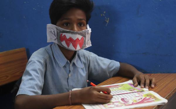 An Indian student wears a self-made mask during class in Hyderabad, India, on Wednesday. The country has reported at least 29 cases of the virus. An Indian student wears a self-made mask during class in Hyderabad, India, on Wednesday. The country has reported at least 29 cases of the virus.