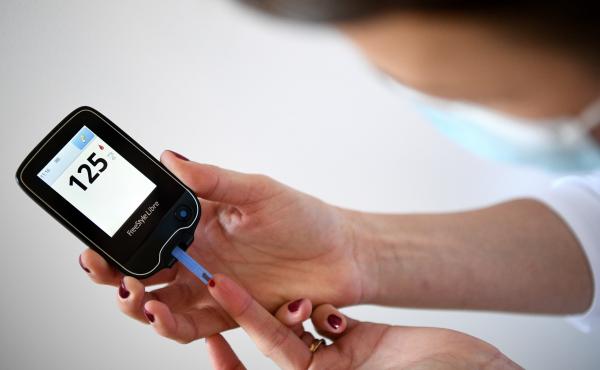 A woman with diabetes uses a glucometer to measure the glycemia in her blood on March 24, 2020. A woman with diabetes uses a glucometer to measure the glycemia in her blood on March 24, 2020.