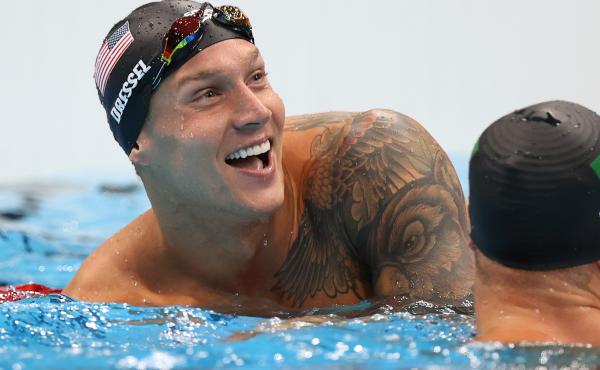U.S. star Caeleb Dressel reacts after winning the gold medal and breaking the Olympic record in the men's 50 meter freestyle final at the Tokyo Olympics. U.S. star Caeleb Dressel reacts after winning the gold medal and breaking the Olympic record in the men's 50 meter freestyle final at the Tokyo Olympics.