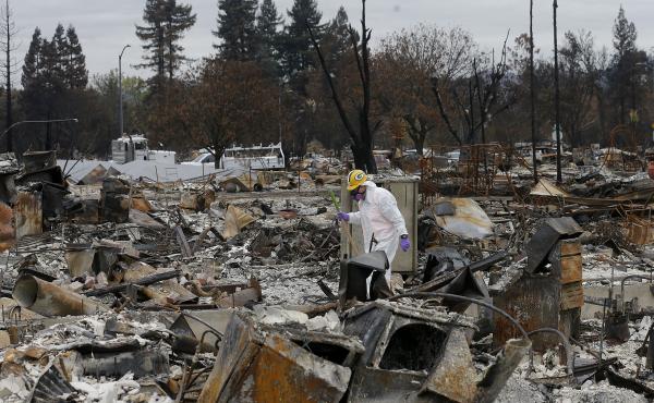 Work crews remove debris at the site of a home destroyed by fires in the Coffey Park area of Santa Rosa, Calif., last month. Thousands of homes and other structures were destroyed by wildfires in the area. Work crews remove debris at the site of a home destroyed by fires in the Coffey Park area of Santa Rosa, Calif., last month. Thousands of homes and other structures were destroyed by wildfires in the area.