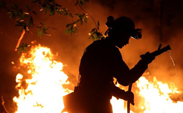 Cal Fire firefighter Trevor Smith battles the Tubbs Fire near Calistoga, Calif., on Thursday. Wildfires in Northern California have killed dozens of people and destroyed thousands of homes and businesses. Cal Fire firefighter Trevor Smith battles the Tubbs Fire near Calistoga, Calif., on Thursday. Wildfires in Northern California have killed dozens of people and destroyed thousands of homes and businesses.