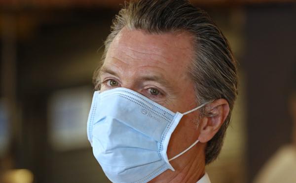 California Gov. Gavin Newsom, here in Sacramento on Friday, has ordered face coverings be required in public spaces statewide. California Gov. Gavin Newsom, here in Sacramento on Friday, has ordered face coverings be required in public spaces statewide.