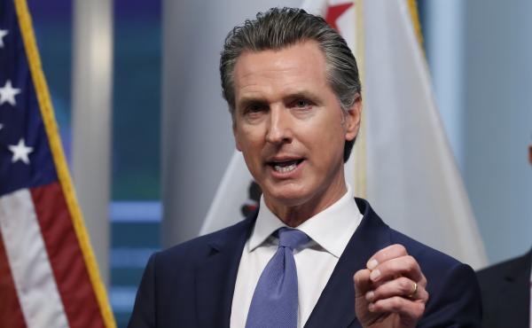 California Gov. Gavin Newsom gives an update to the state's response to the coronavirus, at the Governor's Office of Emergency Services in Rancho Cordova, Calif., on Tuesday. California Gov. Gavin Newsom gives an update to the state's response to the coronavirus, at the Governor's Office of Emergency Services in Rancho Cordova, Calif., on Tuesday.