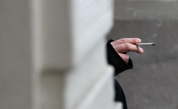 A smoker in San Francisco holds a cigarette. If Gov. Jerry Brown signs the bill, California will become the second state to raise the age limit for buying tobacco products from 18 to 21. A smoker in San Francisco holds a cigarette. If Gov. Jerry Brown signs the bill, California will become the second state to raise the age limit for buying tobacco products from 18 to 21.