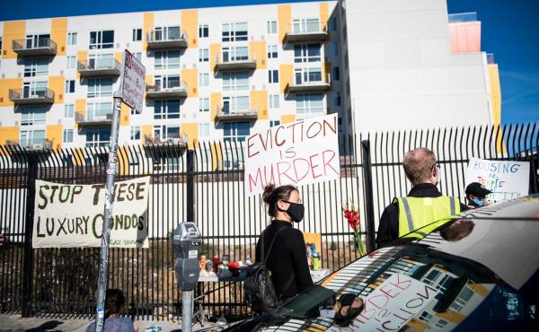 A demonstrator holds a sign in the Mission in San Francisco on Nov, 16 calling for shelter-in-place hotel rooms to remain available for unhoused residents. A demonstrator holds a sign in the Mission in San Francisco on Nov, 16 calling for shelter-in-place hotel rooms to remain available for unhoused residents.