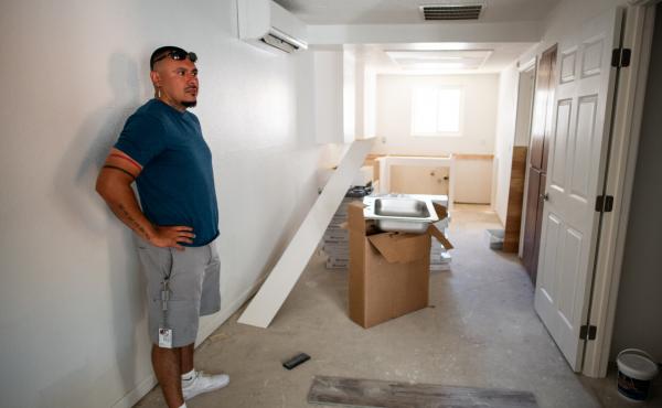 Joshua Ray, a social worker with the Scotts Valley Band of Pomo Indians, inside one of the apartments of the building tribal leaders bought in Lakeport, Calif., through Homekey. Joshua Ray, a social worker with the Scotts Valley Band of Pomo Indians, inside one of the apartments of the building tribal leaders bought in Lakeport, Calif., through Homekey.
