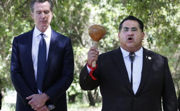 Gov. Gavin Newsom, left, bows his head as Assemblyman James Ramos opens a meeting with tribal leaders from around the state in 2019 in West Sacramento, Calif. In 2021, Ramos authored, and Newsom signed, a law to erect a monument to Native Americans in Sac Gov. Gavin Newsom, left, bows his head as Assemblyman James Ramos opens a meeting with tribal leaders from around the state in 2019 in West Sacramento, Calif. In 2021, Ramos authored, and Newsom signed, a law to erect a monument to Native Americans in Sac