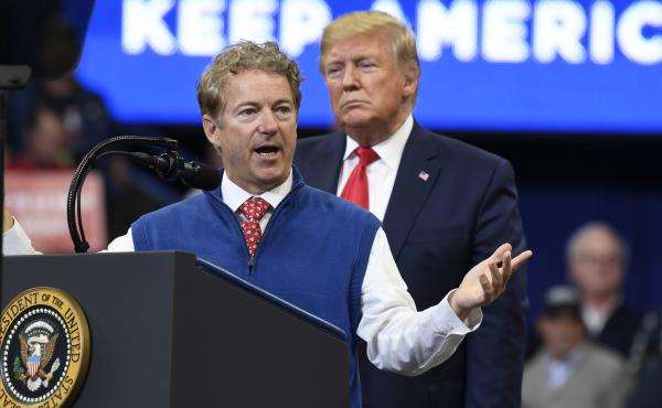 President Trump listens Monday as Sen. Rand Paul, R-Ky., speaks during a campaign rally in Lexington, Ky., in which Paul called on the media to release the name of the whistleblower. President Trump listens Monday as Sen. Rand Paul, R-Ky., speaks during a campaign rally in Lexington, Ky., in which Paul called on the media to release the name of the whistleblower.