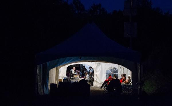 People who illegally crossed the Canada-U.S. border near Hemmingford, Quebec, are processed in a tent after being arrested by the Royal Canadian Mounted Police on Saturday. The flow of asylum-seekers has increased dramatically in recent weeks, and the wai People who illegally crossed the Canada-U.S. border near Hemmingford, Quebec, are processed in a tent after being arrested by the Royal Canadian Mounted Police on Saturday. The flow of asylum-seekers has increased dramatically in recent weeks, and the wai