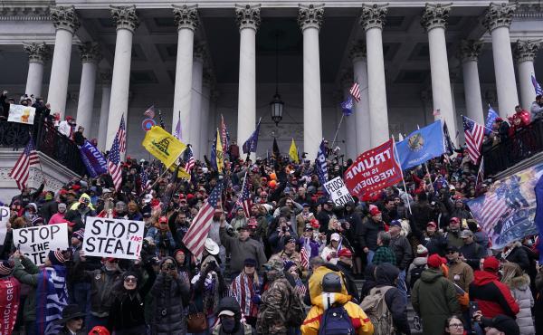 Rioters take to the steps of the U.S. Capitol on Jan. 6. An NPR analysis found more Capitol riot defendants may have ties to the Oath Keepers, a far-right group, than was previously known. Rioters take to the steps of the U.S. Capitol on Jan. 6. An NPR analysis found more Capitol riot defendants may have ties to the Oath Keepers, a far-right group, than was previously known.
