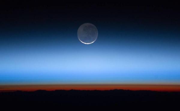 Earth's atmosphere photographed from the International Space Station. Greenhouse gases have accumulated rapidly and are trapping extra heat in the atmosphere. It will take decades for the gases to break down naturally or be reabsorbed on Earth's surface. Earth's atmosphere photographed from the International Space Station. Greenhouse gases have accumulated rapidly and are trapping extra heat in the atmosphere. It will take decades for the gases to break down naturally or be reabsorbed on Earth's surface.