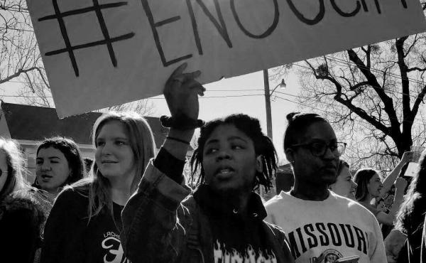 Students hold signs reading "#ENOUGH" during Central High School's walkout on Wednesday. Students hold signs reading "#ENOUGH" during Central High School's walkout on Wednesday.