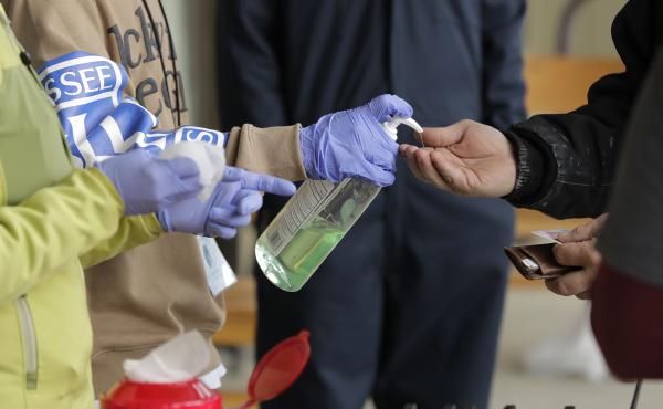 A patient arrives to pick up medication for opioid addiction and is given hand sanitizer at a clinic in Olympia, Wash. The pandemic is changing the distribution networks and supplies of street drugs across the United States, authorities say. A patient arrives to pick up medication for opioid addiction and is given hand sanitizer at a clinic in Olympia, Wash. The pandemic is changing the distribution networks and supplies of street drugs across the United States, authorities say.