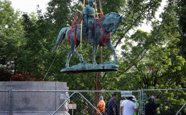 Workers remove a statue of Confederate Gen. Robert E. Lee in Charlottesville, Va., in July. Initial plans to remove the statue four years ago sparked the infamous Unite the Right rally where 32-year-old Heather Heyer was killed. Workers remove a statue of Confederate Gen. Robert E. Lee in Charlottesville, Va., in July. Initial plans to remove the statue four years ago sparked the infamous Unite the Right rally where 32-year-old Heather Heyer was killed.
