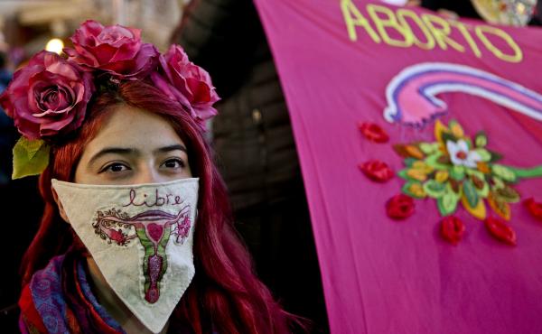 During a march last month in favor of President Michelle Bachelet's bill, a demonstrator displays a handkerchief with an embroidered image of a uterus and the word "free" in Spanish. During a march last month in favor of President Michelle Bachelet's bill, a demonstrator displays a handkerchief with an embroidered image of a uterus and the word "free" in Spanish.