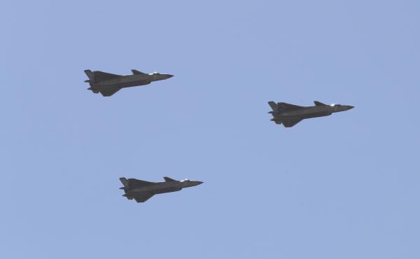 Chinese J-20 stealth fighter jets fly past during a military parade at the Zhurihe training base in China's northern Inner Mongolia region in July. Chinese J-20 stealth fighter jets fly past during a military parade at the Zhurihe training base in China's northern Inner Mongolia region in July.