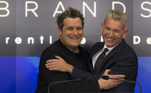 Designer Isaac Mizrahi (left) embraces Robert D'Loren, CEO of Xcel Brands, which once manufactured 70% of its clothes in China. Today that's down to about 20%. The company now manufacturers in a variety of countries, including Indonesia, India and Sri Lan Designer Isaac Mizrahi (left) embraces Robert D'Loren, CEO of Xcel Brands, which once manufactured 70% of its clothes in China. Today that's down to about 20%. The company now manufacturers in a variety of countries, including Indonesia, India and Sri Lan