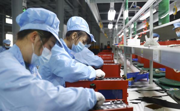 Employees work in the workshop of a lithium battery manufacturing company in Huaibei, eastern China, on Nov. 14. China posted a record trade surplus in November, led by a surge in exports to the United States. Employees work in the workshop of a lithium battery manufacturing company in Huaibei, eastern China, on Nov. 14. China posted a record trade surplus in November, led by a surge in exports to the United States.