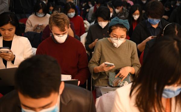 Journalists wearing face masks — in an effort to protect against the coronavirus — gather for a news conference earlier this year in Beijing. Early Wednesday, China said it was planning to pull the press credentials of certain journalists employed by Journalists wearing face masks — in an effort to protect against the coronavirus — gather for a news conference earlier this year in Beijing. Early Wednesday, China said it was planning to pull the press credentials of certain journalists employed by