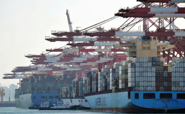 Cargo containers are loaded on ships at a port in Qingdao in China's eastern Shandong province in April. China said it will impose tariffs of 5 percent to 10 percent on $60 billion worth of U.S. products, starting on Monday. Cargo containers are loaded on ships at a port in Qingdao in China's eastern Shandong province in April. China said it will impose tariffs of 5 percent to 10 percent on $60 billion worth of U.S. products, starting on Monday.