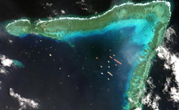 Overview of Whitsun Reef in the South China Sea and Chinese vessels moored in the waters surrounding the boomerang-shaped coral reef on March 23. Overview of Whitsun Reef in the South China Sea and Chinese vessels moored in the waters surrounding the boomerang-shaped coral reef on March 23.