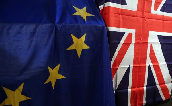 European Union and U.K. Union Jack flags hang at a meeting for U.K. citizens living in Germany to discuss the implications of the proposed "Brexit" from the EU. European Union and U.K. Union Jack flags hang at a meeting for U.K. citizens living in Germany to discuss the implications of the proposed "Brexit" from the EU.