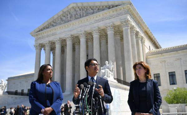 ACLU's Voting Rights Project Director Dale Ho (center) speaks outside the U.S. Supreme Court in April after arguing on behalf of plaintiffs in the lawsuits over the citizenship question the Trump administration wants to add to the 2020 census. ACLU's Voting Rights Project Director Dale Ho (center) speaks outside the U.S. Supreme Court in April after arguing on behalf of plaintiffs in the lawsuits over the citizenship question the Trump administration wants to add to the 2020 census.