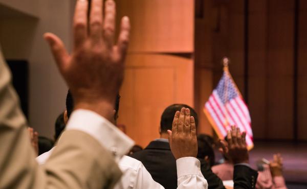 Newly sworn-in U.S. citizens gather for a naturalization ceremony at the Rachel M. Schlesinger Concert Hall and Arts Center in Alexandria, Va., in August. The Trump administration is planning to include a question about U.S. citizenship status on the 2020 Newly sworn-in U.S. citizens gather for a naturalization ceremony at the Rachel M. Schlesinger Concert Hall and Arts Center in Alexandria, Va., in August. The Trump administration is planning to include a question about U.S. citizenship status on the 2020
