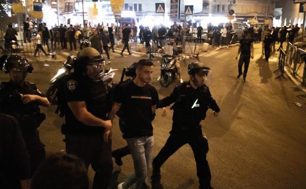Israeli police take a Palestinian into custody during a protest at the Masjid al-Aqsa compound in East Jerusalem on Sunday. Israeli police take a Palestinian into custody during a protest at the Masjid al-Aqsa compound in East Jerusalem on Sunday.