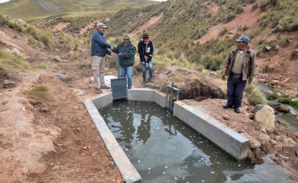 Villagers in Canchayllo stand by a reconstructed canal. Villagers in Canchayllo stand by a reconstructed canal.
