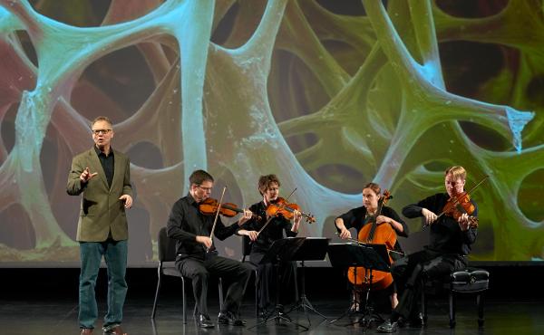 Robert Davies (standing) and the quartet during a performance of "The Crossroads Project." Musicians include (left to right) Robert Waters, Rebecca McFaul, Anne Francis Bayless and Bradley Ottesen. Robert Davies (standing) and the quartet during a performance of "The Crossroads Project." Musicians include (left to right) Robert Waters, Rebecca McFaul, Anne Francis Bayless and Bradley Ottesen.