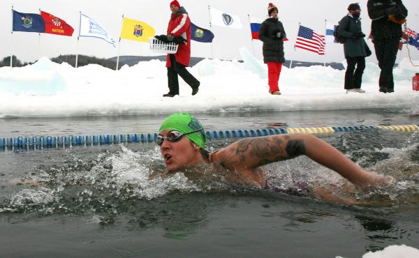 Daina Bouquin competes in the first U.S. Winter Swimming Championships on Saturday in Lake Memphremagog near Newport, Vt. The event drew swimmers from around the world to race in icy water that was below 32 degrees F. Daina Bouquin competes in the first U.S. Winter Swimming Championships on Saturday in Lake Memphremagog near Newport, Vt. The event drew swimmers from around the world to race in icy water that was below 32 degrees F.
