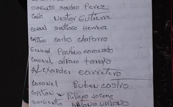 A notepad shows a list of the military officers who spoke at the special tribunal hearing in Ocaña. A notepad shows a list of the military officers who spoke at the special tribunal hearing in Ocaña.