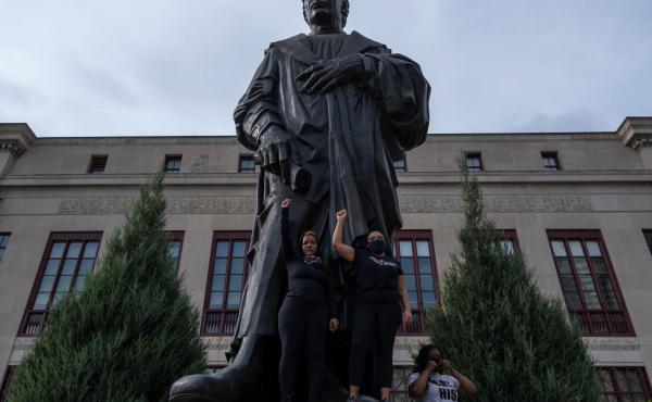 A statue of Christopher Columbus was removed from in front of City Hall in Columbus, Ohio, on Wednesday. The statue has been a focal point for racial justice protests; earlier this week, demonstrators climbed onto its pedestal to pose for photos. A statue of Christopher Columbus was removed from in front of City Hall in Columbus, Ohio, on Wednesday. The statue has been a focal point for racial justice protests; earlier this week, demonstrators climbed onto its pedestal to pose for photos.