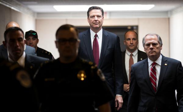 Former FBI Director James Comey leaves a closed session with the Senate Intelligence Committee on Capitol Hill on Thursday. Former FBI Director James Comey leaves a closed session with the Senate Intelligence Committee on Capitol Hill on Thursday.