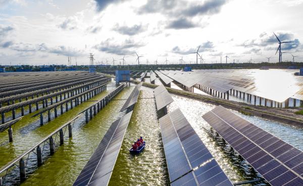 Electrical workers check solar panels at a photovoltaic power station built in a fishpond in Haian in China's eastern Jiangsu province. Electrical workers check solar panels at a photovoltaic power station built in a fishpond in Haian in China's eastern Jiangsu province.