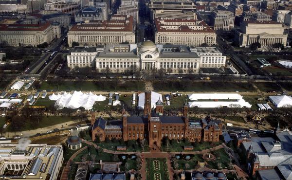 An aerial view of the National Mall in Washington, D.C., with the Smithsonian Institution Building ("The Castle") in the foreground and the Smithsonian's National Museum of Natural History in the background. An aerial view of the National Mall in Washington, D.C., with the Smithsonian Institution Building ("The Castle") in the foreground and the Smithsonian's National Museum of Natural History in the background.